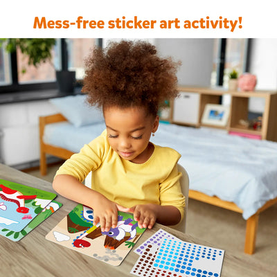 Young girl creating dinosaur sticker art with Dot it! World of Dinosaurs kit