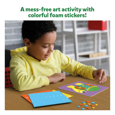 Young boy creating a turtle design with colorful foam stickers in The Ultimate Animal Art Bundle