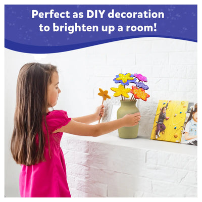 Young girl arranging colorful flower-shaped craft decorations in a vase for Poke-in Art Flower Bouquet