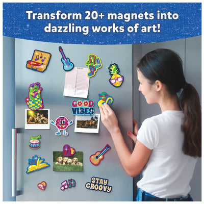 Young woman decorating refrigerator with colorful magnets using Foil Fun Groovy Beats Art Kit