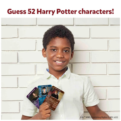 Young boy holding three Harry Potter character cards from Guess in 10 trivia game