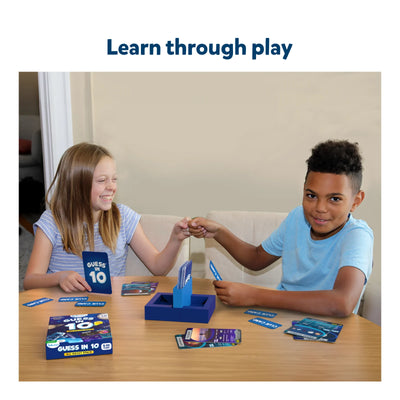 Two children playing the space-themed Guess in 10 trivia card game for ages 8 plus