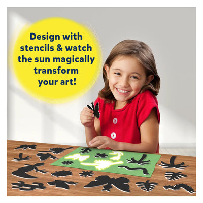 Child creating sun art craft with stencils using the Magical Foil & Sun Art Bundle