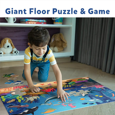 Underwater-themed floor puzzle with cut-out for game pieces from Wildlife Wonders Puzzle Bundle