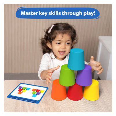Child stacking colorful plastic cups from Silicone Rainbow Sorting toy for early learning