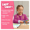 Young girl happily cutting paper with scissors using Snip Snip Unicorns & Princesses craft kit