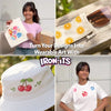 Four-panel image showcasing Iron-Its craft uses. Top-left: girl carries seashell-decorated canvas tote bag. Top-right: canvas pouch with orange slice prints holds sunglasses. Bottom-left: white bucket hat with cherry iron-on. Bottom-right: girl wears flower-print t-shirt. Text: Turn Your Designs Into Wearable Art with Iron Its.