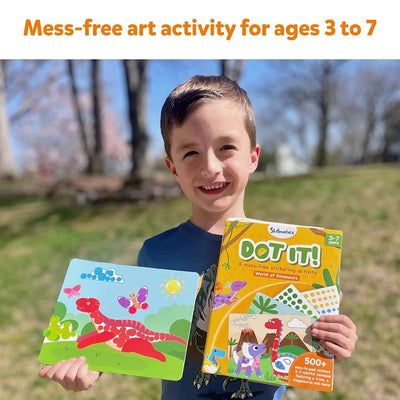Young boy holding two Dinosaur-themed Dot it Mega Combo sticker art books for kids